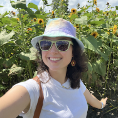 Lydia in a field of sunflowers