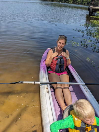 Team member sitting in a canoe