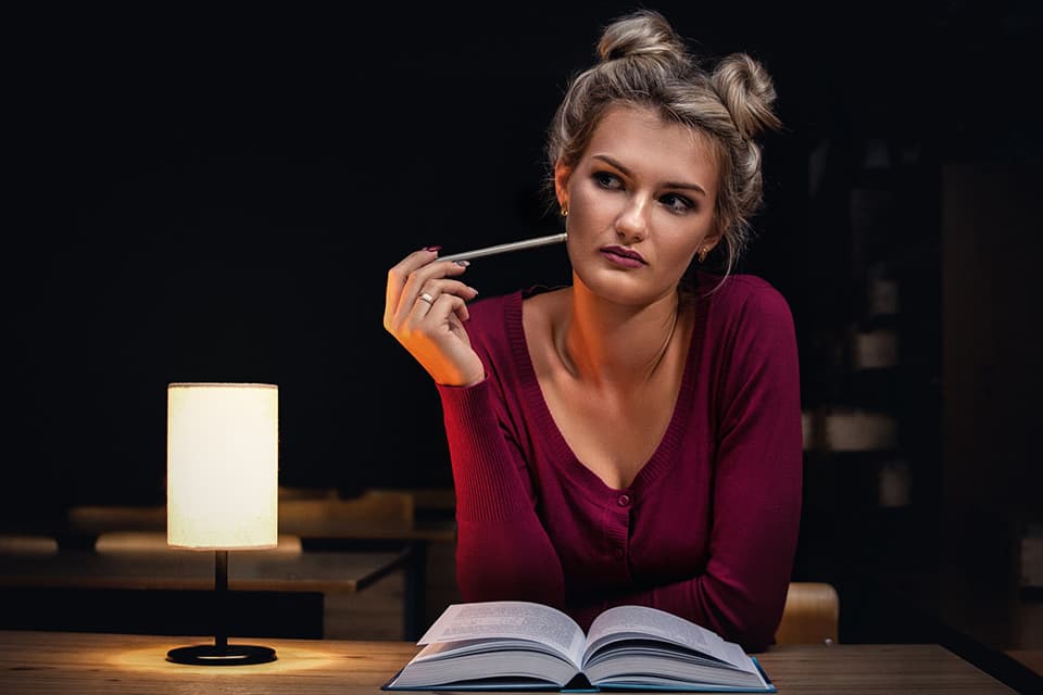 young woman with an open book