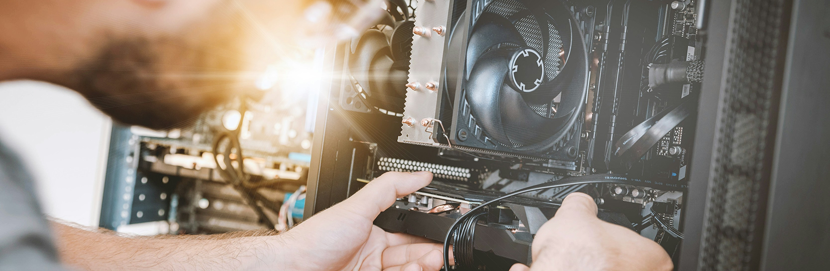 man working on a piece of computer hardware