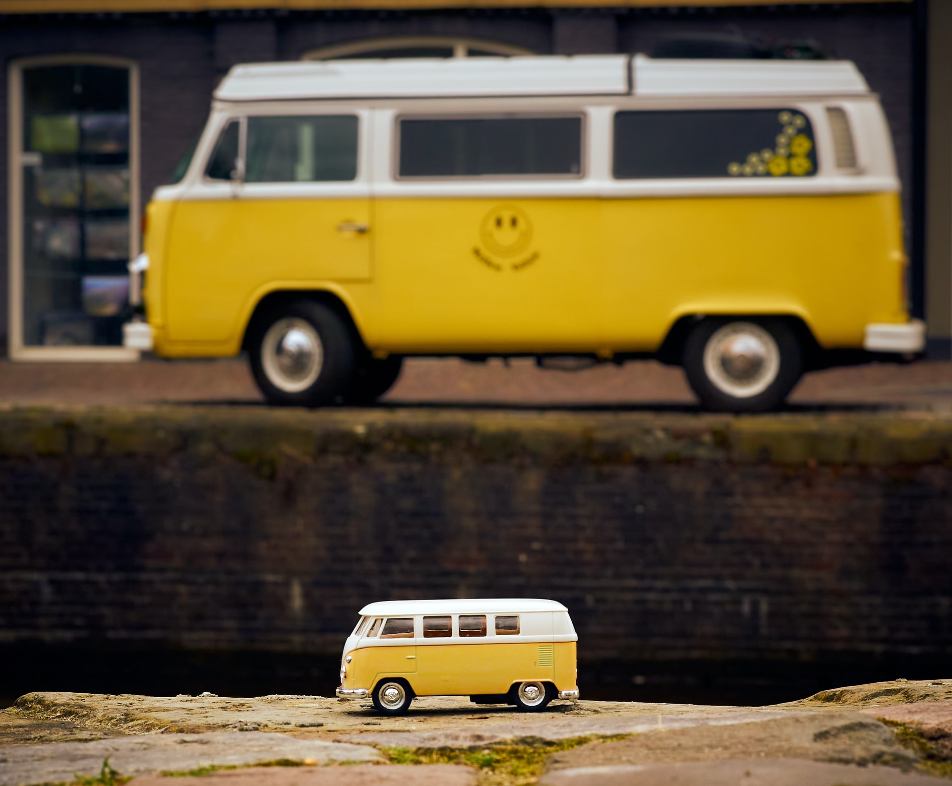 large bus alongside a toy bus