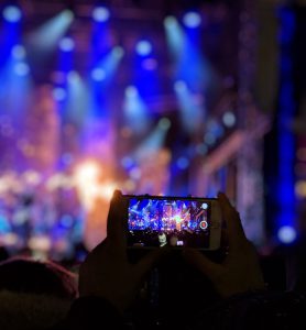 person recording a video on smartphone