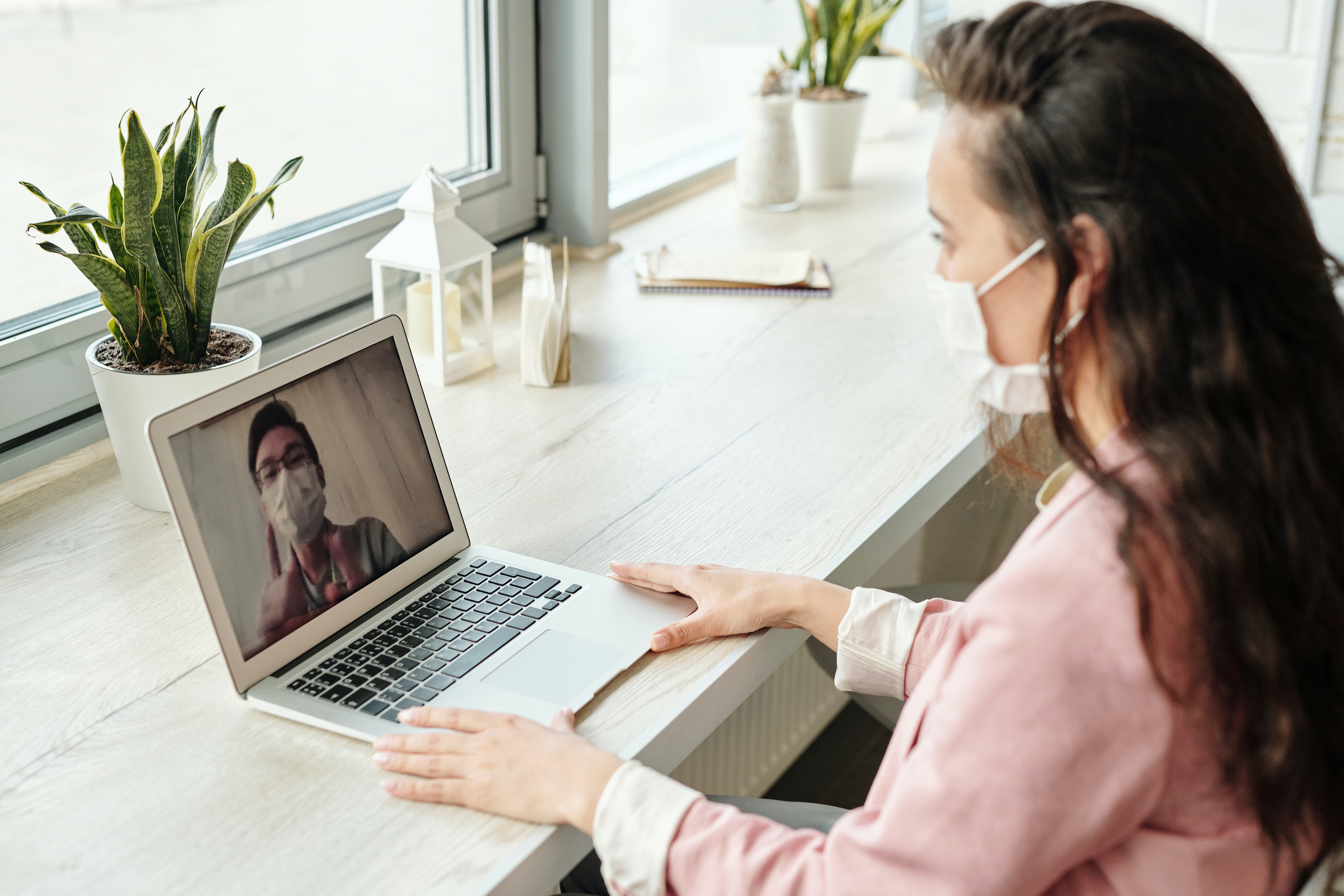 masked person on a video chat