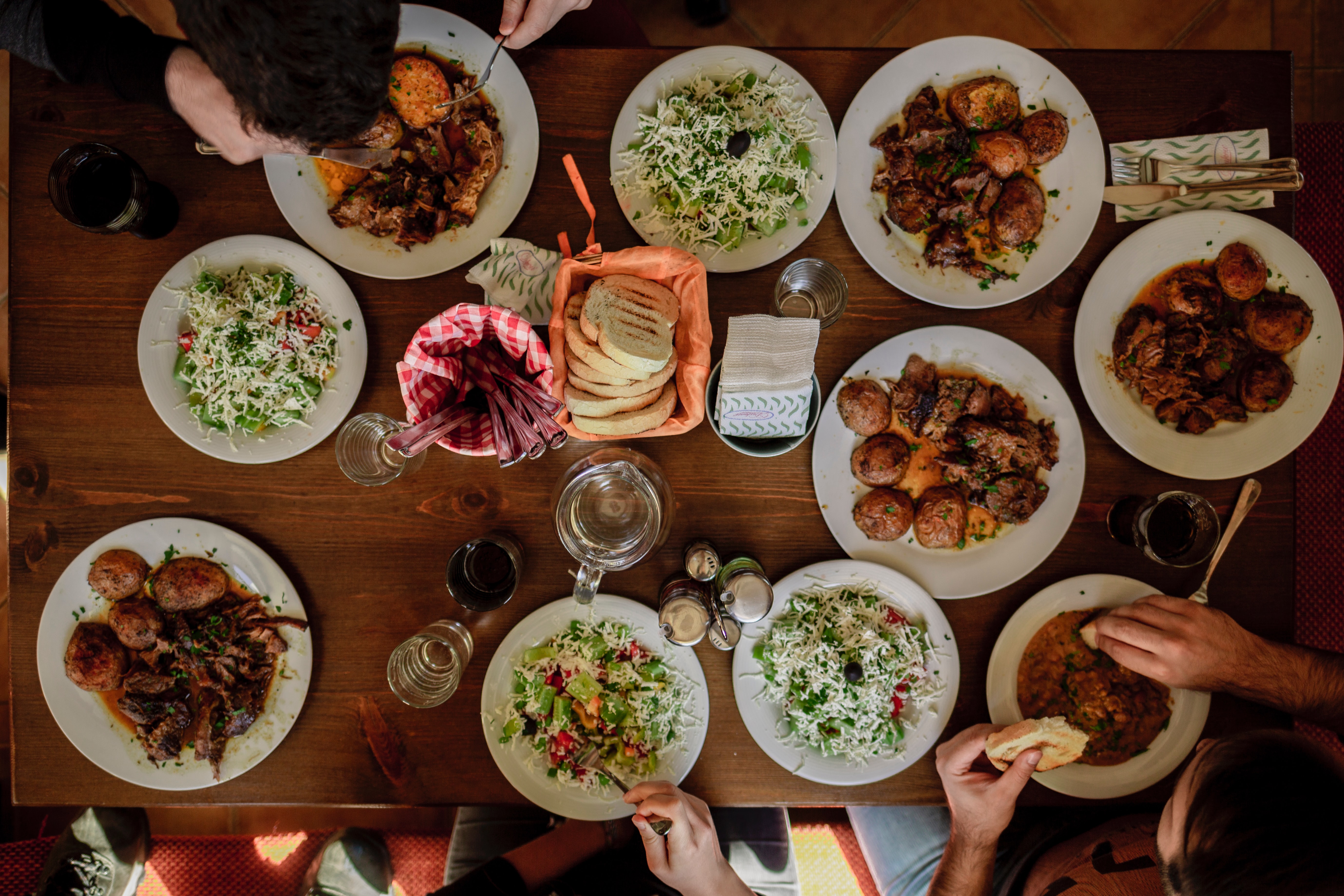People gathered around table for a meal. 