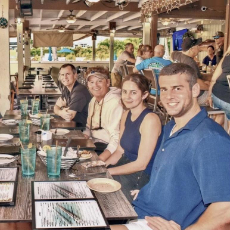 David at a restaurant with friends and family