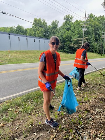 beacon team members picking up trash along the roadside 